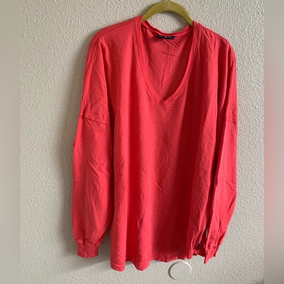 Spirit Jersey Tops - SPIRIT JERSEY Pinkish-Orange jersey. NWOT (L)🌴